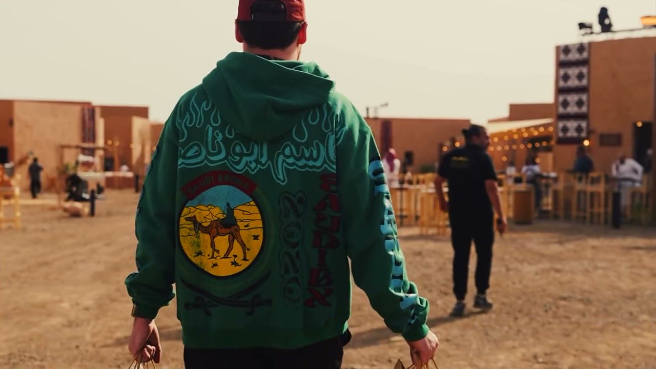 The green Kasseem Abu Nasser hoodie at the AlUla stand